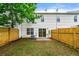Fenced backyard featuring a patio and sliding glass doors for easy indoor-outdoor living at 89 Prospect Path, Hiram, GA 30141