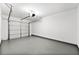 Spacious two-car garage with a white garage door and ample room for parking at 89 Prospect Path, Hiram, GA 30141