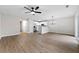 Open-concept living area with new ceiling fan, updated floors, and natural light, great for entertaining and relaxing at 89 Prospect Path, Hiram, GA 30141