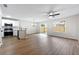 Sun-filled living space with laminate floors, ceiling fan, and an updated kitchen, perfect for gatherings at 89 Prospect Path, Hiram, GA 30141