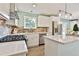 Well-equipped kitchen featuring stainless steel appliances, bright countertops, and updated cabinetry at 191 Pine Ne St, Fairburn, GA 30213