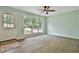Bright living room with large windows and hardwood floors at 191 Pine Ne St, Fairburn, GA 30213