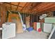 The interior of this shed shows exposed rafters and ample storage capacity for all your tools at 191 Pine Ne St, Fairburn, GA 30213