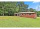 View of the property showing the home's yard space and side exterior details at 191 Pine Ne St, Fairburn, GA 30213