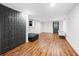 Finished basement with gray accent wall, large closet, and hardwood floors at 2020 New Kemp Rd, Marietta, GA 30066