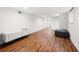 Finished basement area with modern minimalist furnishings and hardwood flooring at 2020 New Kemp Rd, Marietta, GA 30066