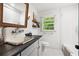 Bright bathroom with a classic sink, subway tile shower, and window at 2020 New Kemp Rd, Marietta, GA 30066