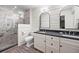 Modern bathroom with a double vanity, granite countertop, shiplap walls, and a glass-enclosed shower with marble tile at 2020 New Kemp Rd, Marietta, GA 30066
