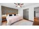Bedroom features a king-size bed with decorative wallpaper, hardwood floors, large closet and natural light at 2020 New Kemp Rd, Marietta, GA 30066