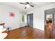 Bedroom with hardwood floors, large windows, modern decor, and a view into another room at 2020 New Kemp Rd, Marietta, GA 30066