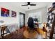 Well-lit bedroom with dark hardwood floors, decorative artwork, ceiling fan and window at 2020 New Kemp Rd, Marietta, GA 30066