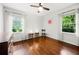Bright bedroom with hardwood floors, large windows providing natural light, and simple, modern decor at 2020 New Kemp Rd, Marietta, GA 30066
