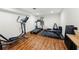 Bright home gym with various workout equipment and hardwood floors at 2020 New Kemp Rd, Marietta, GA 30066
