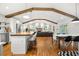 Bright open living space features hardwood floors, wood beams, modern lighting, and seamless flow from kitchen to living areas at 2020 New Kemp Rd, Marietta, GA 30066