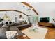 Bright and open living space featuring hardwood floors, fireplace, sectional sofa, seamlessly connecting to the kitchen at 2020 New Kemp Rd, Marietta, GA 30066