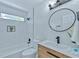 Bathroom features a stylish vanity, a modern mirror, and a tiled shower and tub combo at 259 Tarragon Sw Way, Atlanta, GA 30331