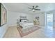 Spacious main bedroom with neutral colors and a ceiling fan, featuring decorative rug at 259 Tarragon Sw Way, Atlanta, GA 30331