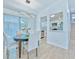 Dining area featuring modern chandelier and a view into the kitchen with stainless appliances at 259 Tarragon Sw Way, Atlanta, GA 30331
