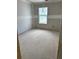 Bedroom with neutral walls, natural light from window and open space for design creativity at 31 Benscot Dr, Austell, GA 30106