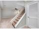 Basement with carpeted stairs, ceiling fan, and ample open space at 386 Link Rd, Alpharetta, GA 30022