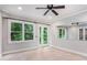 Bright bedroom with large windows, french doors, ceiling fan and mirrored wall at 386 Link Rd, Alpharetta, GA 30022