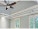 Bedroom with tray ceiling, ceiling fan, plantation shutters and light paint at 386 Link Rd, Alpharetta, GA 30022