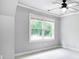 Bedroom featuring gray walls and neutral carpet with one window providing ample natural light at 386 Link Rd, Alpharetta, GA 30022