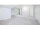 Spacious bedroom featuring neutral carpet, ample natural light, and crisp white trim and doors at 386 Link Rd, Alpharetta, GA 30022