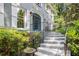 Welcoming front entrance featuring brick steps, wrought iron railing, and well-manicured landscaping at 386 Link Rd, Alpharetta, GA 30022