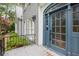 Welcoming front entrance with a glass-paneled door and well-manicured landscaping at 386 Link Rd, Alpharetta, GA 30022
