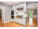 Spacious kitchen featuring stainless steel appliances, a gas range, and views into the dining room at 386 Link Rd, Alpharetta, GA 30022