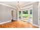 Bright living room showcasing hardwood floors, crown molding, and a bay window overlooking the backyard at 386 Link Rd, Alpharetta, GA 30022