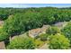 Lovely aerial shot of a suburban home surrounded by lush greenery and mature trees in a peaceful neighborhood at 11280 Brookhollow Trl, Alpharetta, GA 30022