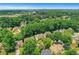 Scenic aerial view of a residential neighborhood with mature trees and well-maintained homes at 11280 Brookhollow Trl, Alpharetta, GA 30022