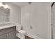 This bathroom features a vanity sink and shower with glass doors at 11280 Brookhollow Trl, Alpharetta, GA 30022