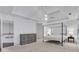 Spacious primary bedroom featuring a tray ceiling, ensuite bathroom, and room for a dresser at 11280 Brookhollow Trl, Alpharetta, GA 30022