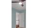 Bedroom features a ceiling fan and a white closet door at 11280 Brookhollow Trl, Alpharetta, GA 30022