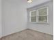 Cozy bedroom with carpet flooring and natural light from the window at 11280 Brookhollow Trl, Alpharetta, GA 30022