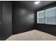 Bedroom with an all-black wall and carpet, and lots of natural light at 11280 Brookhollow Trl, Alpharetta, GA 30022