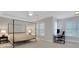 Spacious bedroom with ample natural light features a four-poster bed and dedicated office space at 11280 Brookhollow Trl, Alpharetta, GA 30022