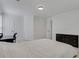 Bright bedroom featuring white walls, carpeted floors, black dresser, and ample natural light at 11280 Brookhollow Trl, Alpharetta, GA 30022