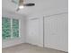 Bedroom featuring neutral walls, carpet floors, and large double door closets at 11280 Brookhollow Trl, Alpharetta, GA 30022