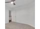 Bright, carpeted bedroom with a ceiling fan and doorway at 11280 Brookhollow Trl, Alpharetta, GA 30022