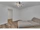 Bedroom offers wood flooring and a modern ceiling light fixture at 11280 Brookhollow Trl, Alpharetta, GA 30022