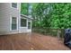 Deck with railing provides a view of the backyard and screened porch at 11280 Brookhollow Trl, Alpharetta, GA 30022