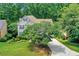 An attractive home with a beautifully landscaped front yard and a driveway at 11280 Brookhollow Trl, Alpharetta, GA 30022