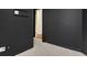 A gray hallway with a carpet and a view of a bedroom at 11280 Brookhollow Trl, Alpharetta, GA 30022