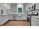 Stylish kitchen with stainless steel appliances, granite countertops, and modern cabinetry at 11280 Brookhollow Trl, Alpharetta, GA 30022