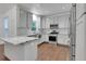 Modern kitchen with granite countertops, stainless steel appliances, and stylish gray cabinets at 11280 Brookhollow Trl, Alpharetta, GA 30022
