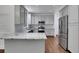 Contemporary kitchen features granite counters, stainless steel appliances, and abundant cabinetry at 11280 Brookhollow Trl, Alpharetta, GA 30022